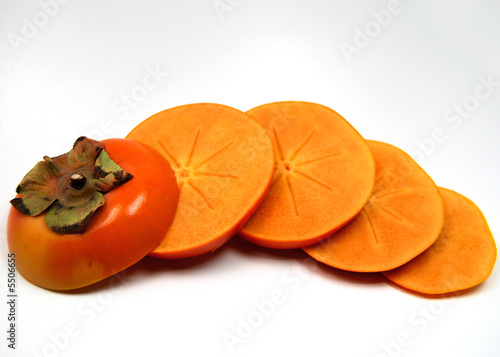 a sliced fuyu persimmon, showing its internal star pattern