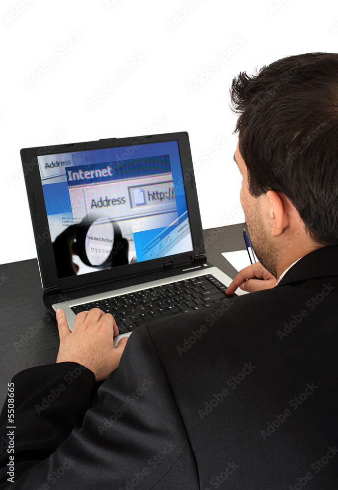 Young business man working at laptop. Isolated on white. Young business man working at laptop. Isolated on white.