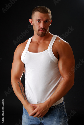 A body builder in a muscle shirt