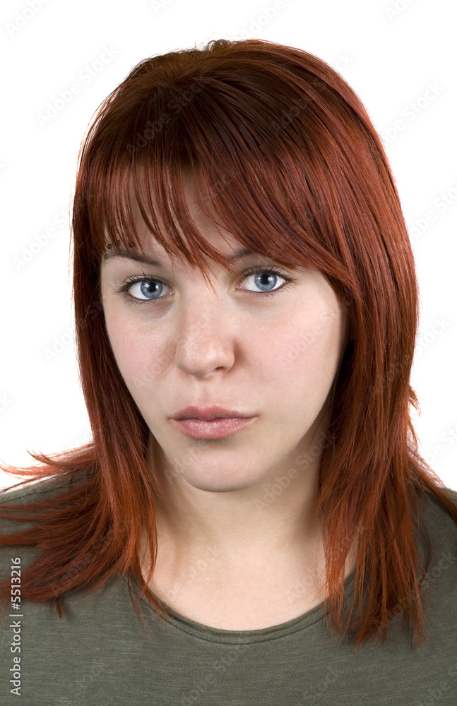 Cute redhead young girl looking at camera and kissing. Cute redhead young girl looking at camera and kissing.