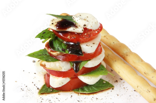 Caprese Salad.  Luscious tomatoes with bocconcini. photo