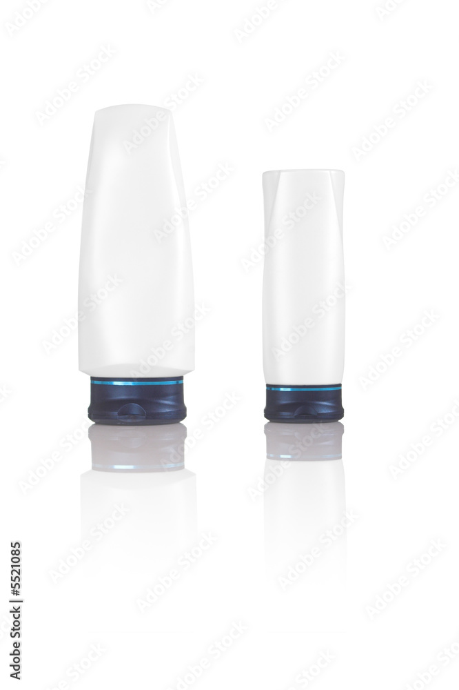 Two white cosmetics bottles with reflection on white Two white cosmetics bottles with reflection on white