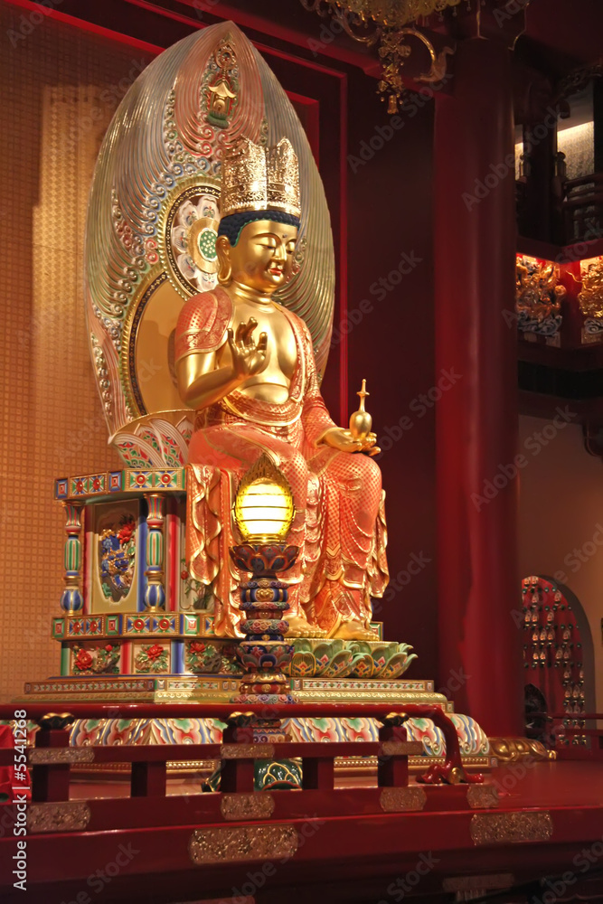 Golden statue of buddha inside a chinese temple