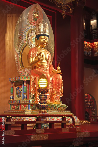 Golden statue of buddha inside a chinese temple