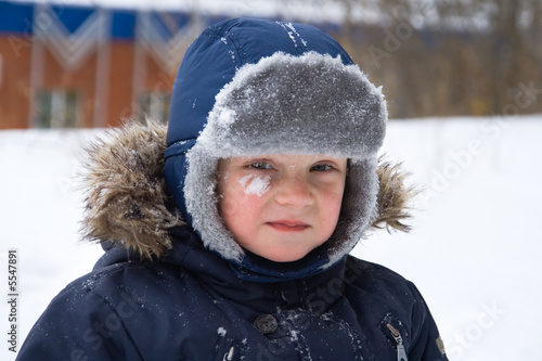 Fotografering Offended little boy on a background of a snow