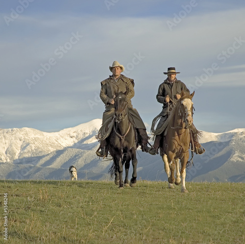 Cowboys on the range, mountain backdrop.  © outdoorsman