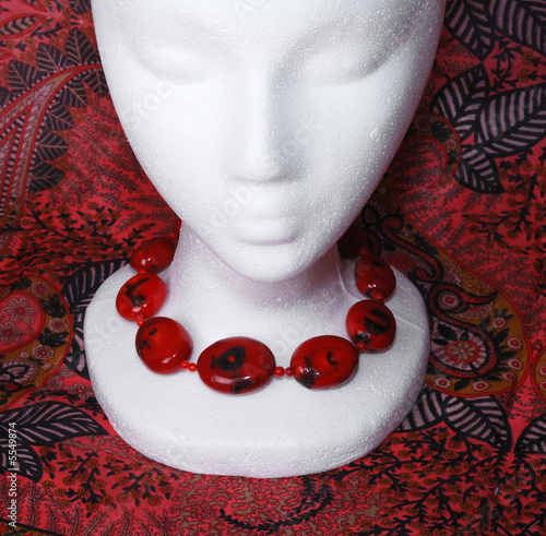 Mannequin's head  with a red coral necklace