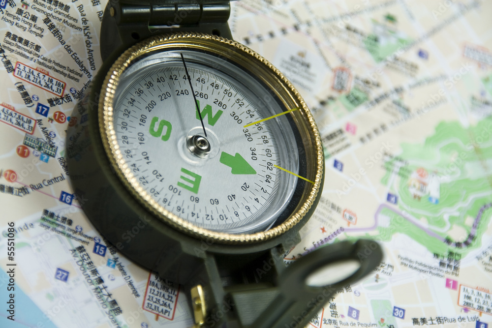 view of a compass on a map. view of a compass on a map.
