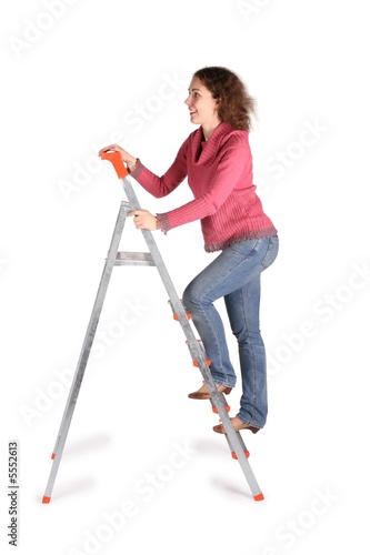 Slika na platnu young woman on  stepladder on white
