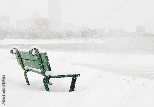 Bench in the snow on Charles River in Boston