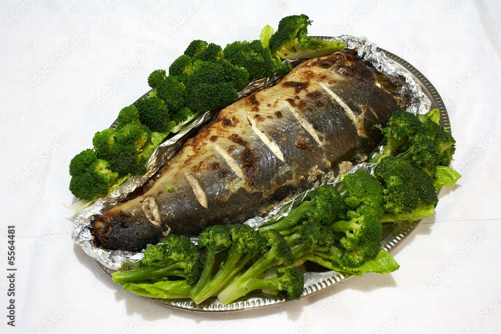 Baked pink salmon served with broccoli Baked pink salmon served with broccoli