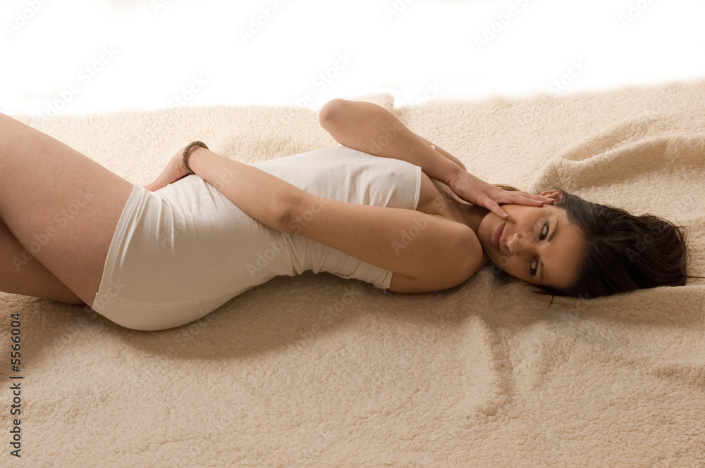 Naklejka premium Young beauty girl lying and doing caressing herself