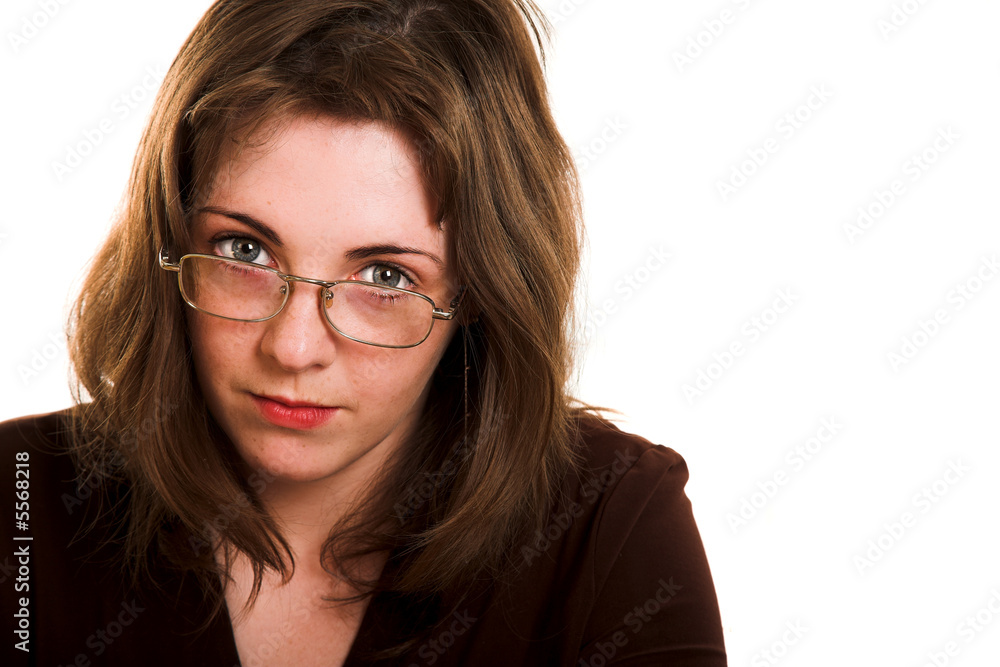 Young woman in glasses with pen in her hand