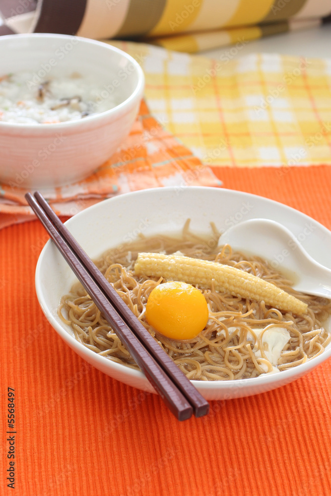 Brown Chinese buckwheat noodles with egg and baby corn Brown Chinese buckwheat noodles with egg and baby corn
