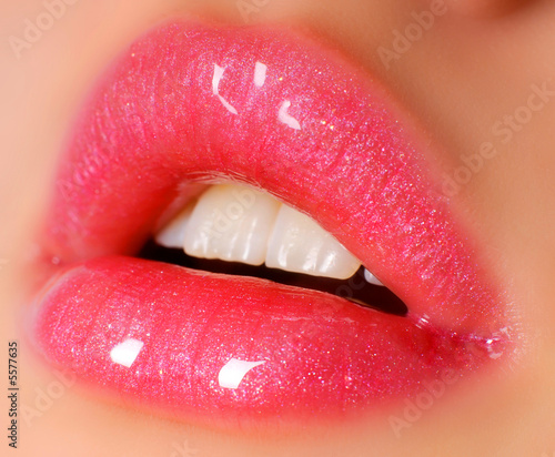 sexy glowing pink lips open for kiss, close-up