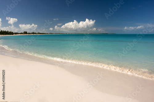 tropical beach with clear water and blue sky