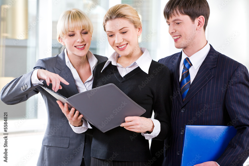 Confident people discussing a plan at business meeting Confident people discussing a plan at business meeting