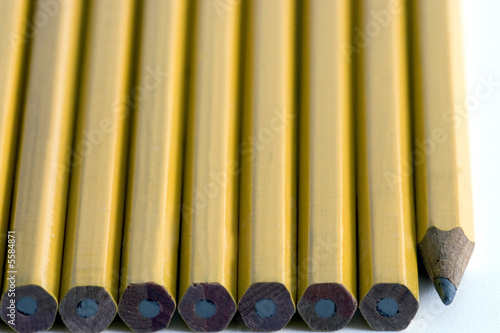 Wooden yellow pencils lined up