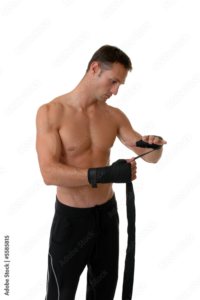 Naklejka premium A boxer wrapping tape around his hands