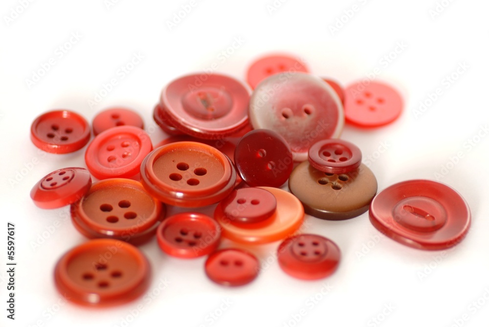 colored sewing buttons on a white background colored sewing buttons on a white background