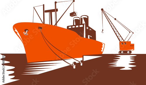 Container ship being loaded by a crane