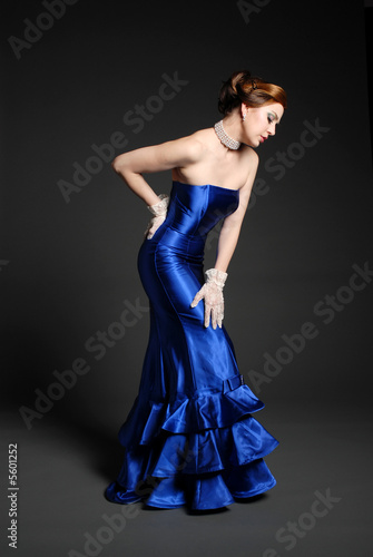 Beautiful woman in sexy blue dress