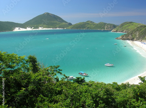 Boats over a crystalline turquoise sea in Arraial do Cabo