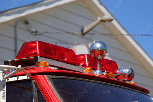 The red alarm lights on the top of a firetruck.