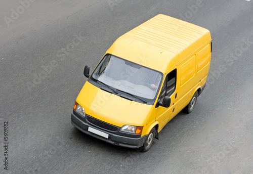 yellow blank pick-up van truck on road isolated