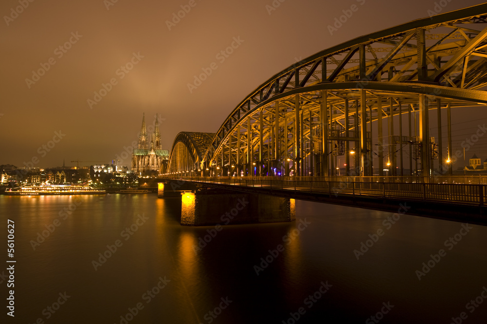 view along cathedral bridge to Cologne cathedral at night