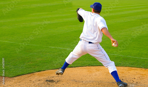 Professional baseball pitcher throwing the ball