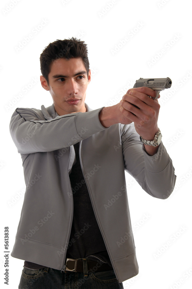 A young man pointing a pistol