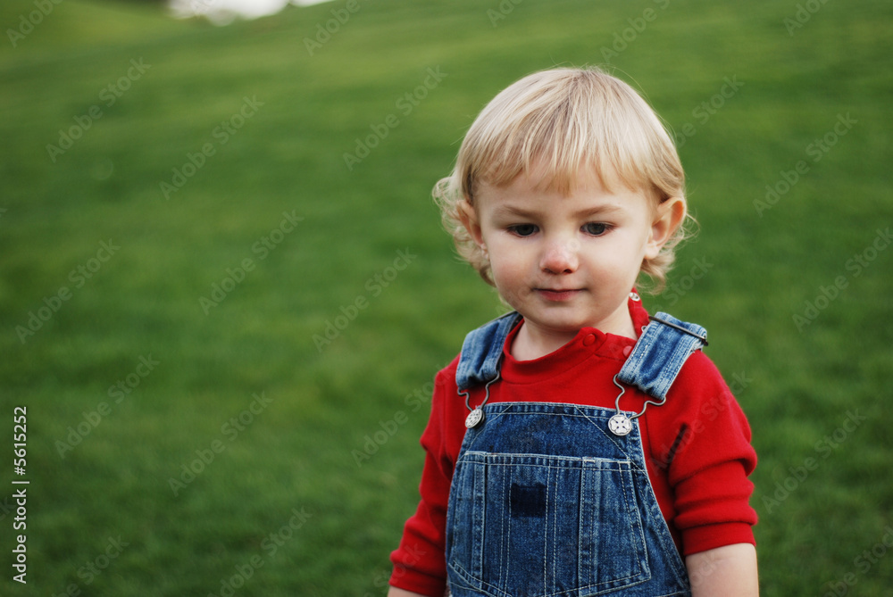 a little kid is enjoying his time in the park a little kid is enjoying his time in the park