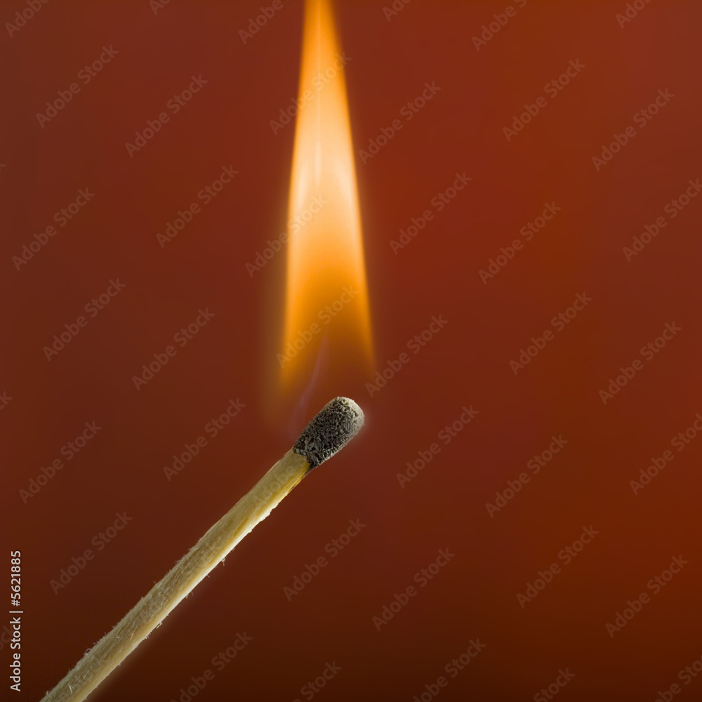 studio close up of lite match and flame studio close up of lite match and flame