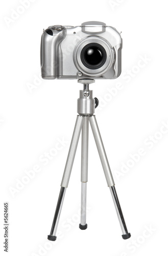 Small silver camera on a tripod. Isolated on white.