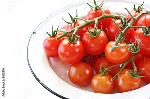 Enamel bowl of cherry tomatoes.  © robynmac