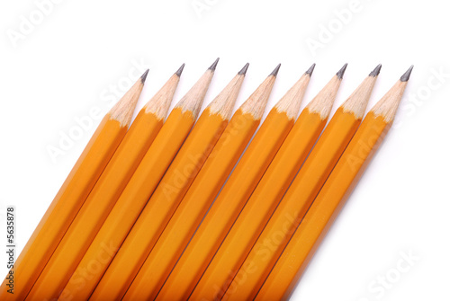 closeup photography of some pencils on white paper photo
