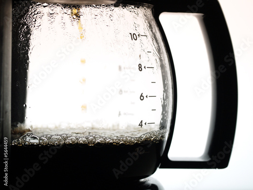 Coffee dripping into jug from coffee percolator