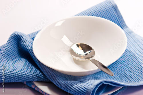 kitchenware series: empty soup-plate wth spoon photo