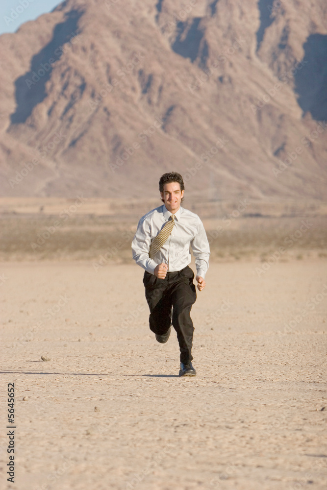 Young businessman running for success Young businessman running for success