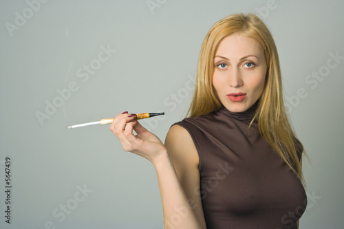 blond woman hold cigarette in hand