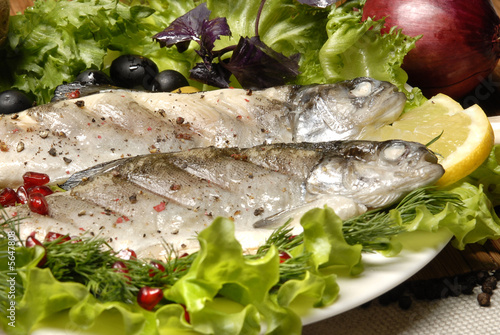 fried fish on the white plate