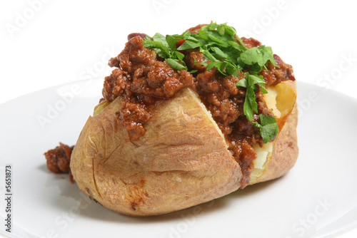 Baked potato topped with chilli con carne
