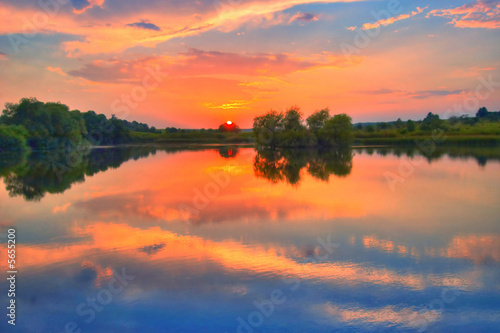 An image of sunrise on a lake