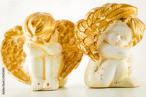 Two sitting angels made of stone