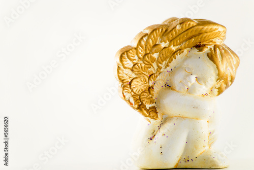 One sitting angel made of stone