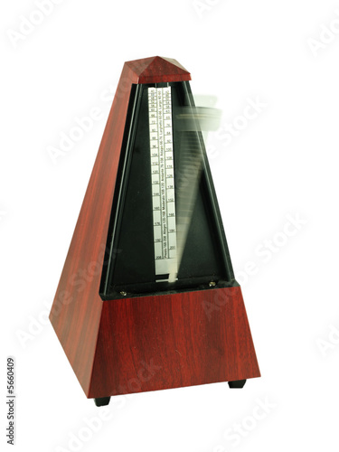Metronome with blurred pendulum showing movement
