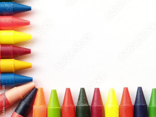 Wax crayons forming border on two sides of image