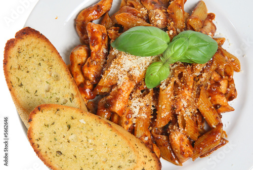 Penne pasta meal with garlic bread