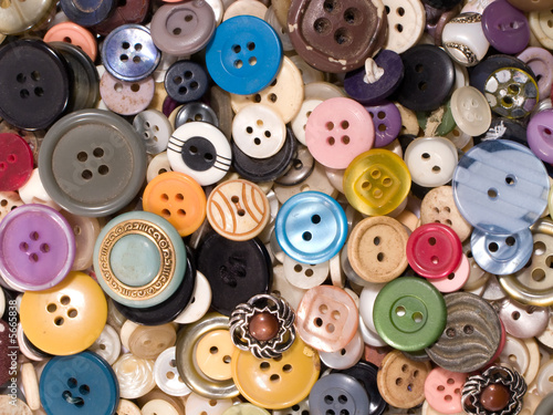 Pile of old and used clothes buttons